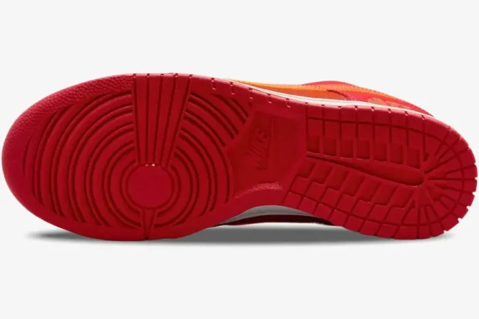 Bottom view of the Nike Dunk Low ATL Special Edition showing the red rubber outsole and traction pattern. - SKU FD0724-657
