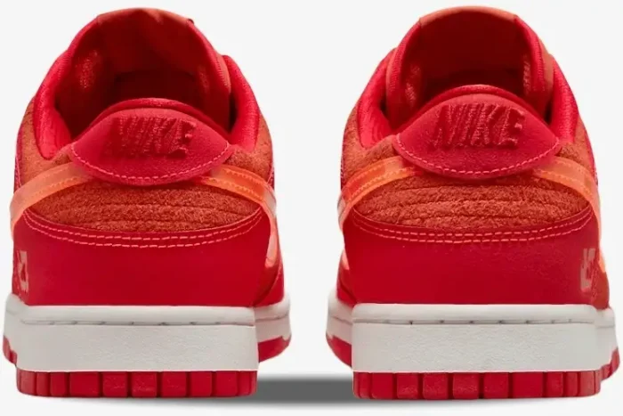 Rear view of Nike Dunk Low ATL Special Edition sneakers in vibrant red with orange accents and white midsoles. - SKU FD0724-657