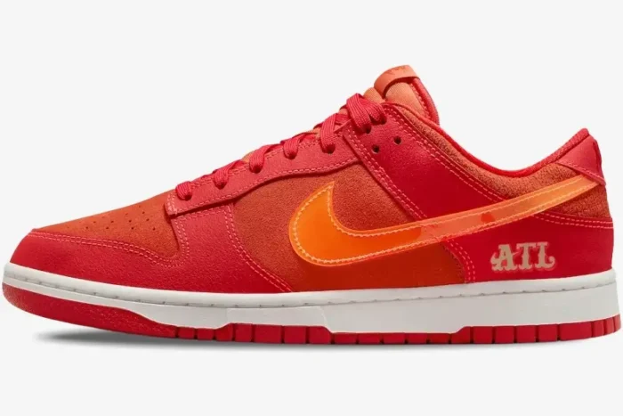 Side profile of Nike Dunk Low ATL Special Edition shoes in red and orange suede with a translucent swoosh. - SKU FD0724-657