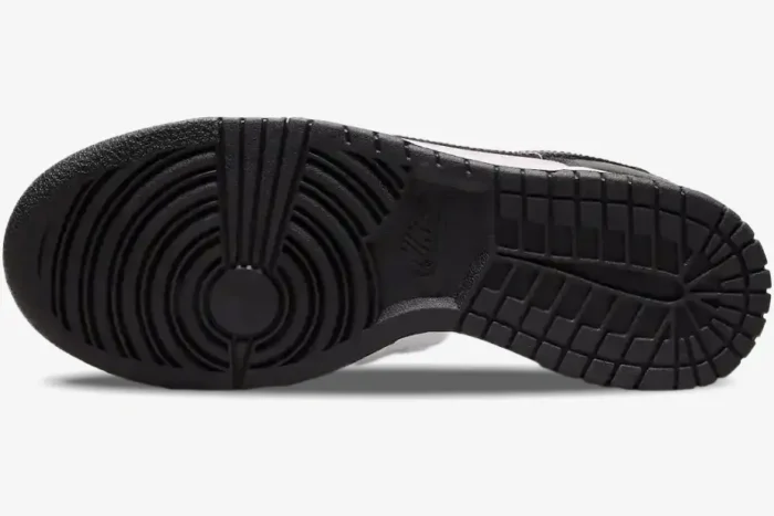 Bottom view of the black rubber outsole of Nike Dunk Low Black Patent Pink Women's Sneakers. - SKU DJ9955-600