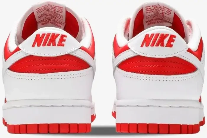 Rear view of Nike Dunk Low Championship Red sneakers in white and red with embroidered heel logo. - SKU DD1391-600
