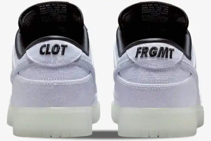 Rear view of Nike Dunk Low x CLOT x Fragment Design White Silk sneakers with black embroidered heel tabs. - SKU FN0315-110