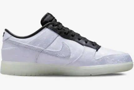 Side profile of Nike Dunk Low x CLOT x Fragment Design White Silk sneaker with patterned upper and black trim. - SKU FN0315-110