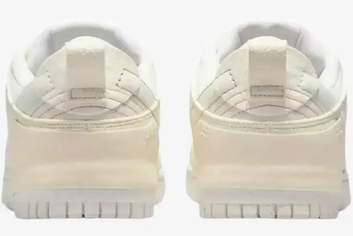 Rear view of Nike Dunk Low Disrupt 2 sneakers in Pale Ivory and Sail colorway. - SKU DH4402-101
