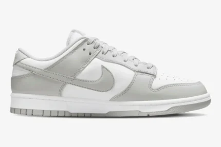Nike Dunk Low Grey Fog sneakers in a side profile view with white and light grey leather panels. - SKU DD1391-103