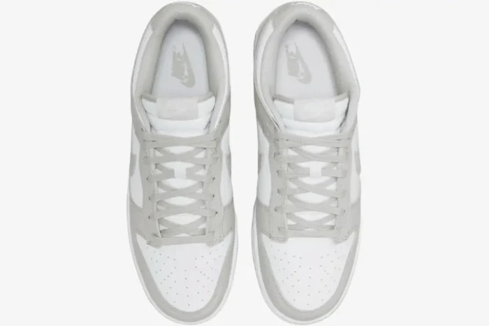 Top-down view of Nike Dunk Low Grey Fog sneakers with white leather and light grey overlays. - SKU DD1391-103