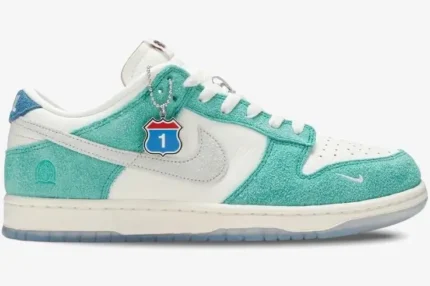 Side profile of Nike Dunk Low x Kasina Neptune Green sneakers with white leather and teal suede overlays. - SKU CZ6501-101