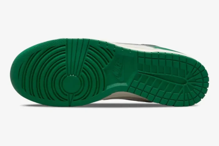 Bottom view of the Nike Dunk Low SE Lottery Malachite Green outsole featuring a vibrant green traction pattern. - SKU DR9654-100