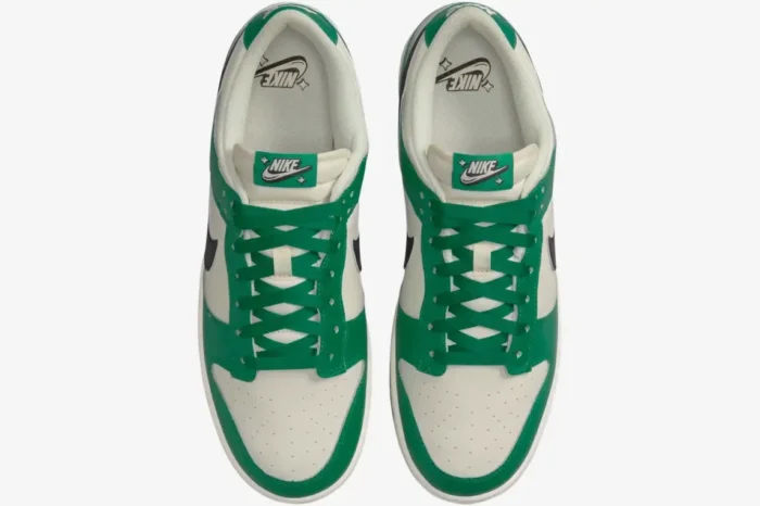 Top-down view of Nike Dunk Low SE Lottery Malachite Green sneakers with green laces and off-white leather. - SKU DR9654-100
