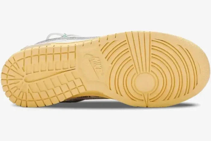 Bottom view of the yellowed rubber outsole of a Nike Dunk Low x Off-White Lot 01 of 50 sneaker. - SKU DM1602-127