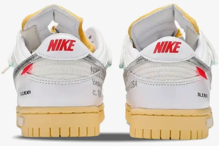 Rear view of Nike Dunk Low x Off-White Lot 01 of 50 sneakers in white with yellowed soles. - SKU DM1602-127