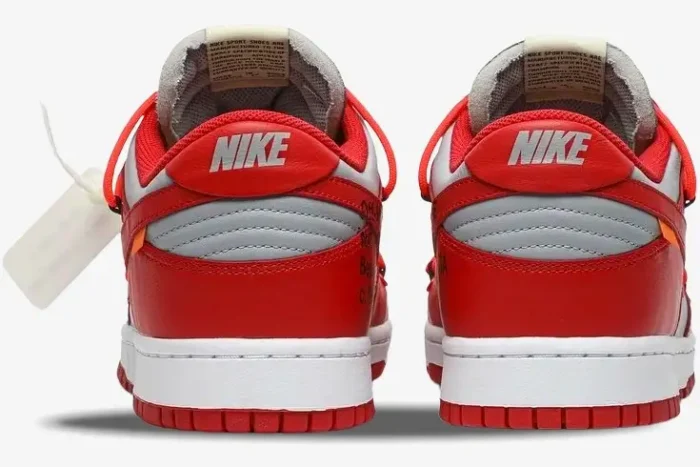 Rear view of Nike Dunk Low x Off-White University Red sneakers showing the heel tabs and white midsoles. - SKU CT0856-600