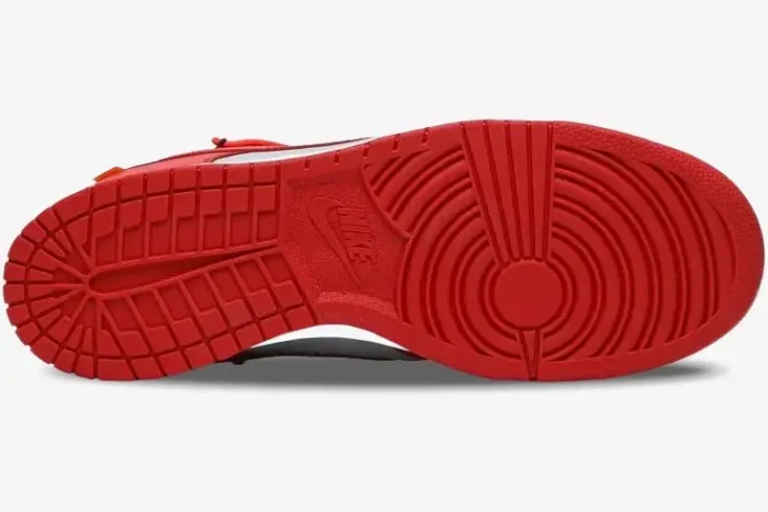 Bottom view of the red rubber outsole of the Nike Dunk Low x Off-White University Red sneaker. - SKU CT0856-600