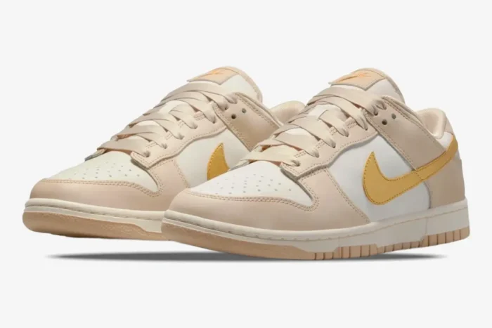 Nike Dunk Low Essential Trend Phantom Metallic Gold women's sneakers, three-quarter front view. - SKU DX5930-001