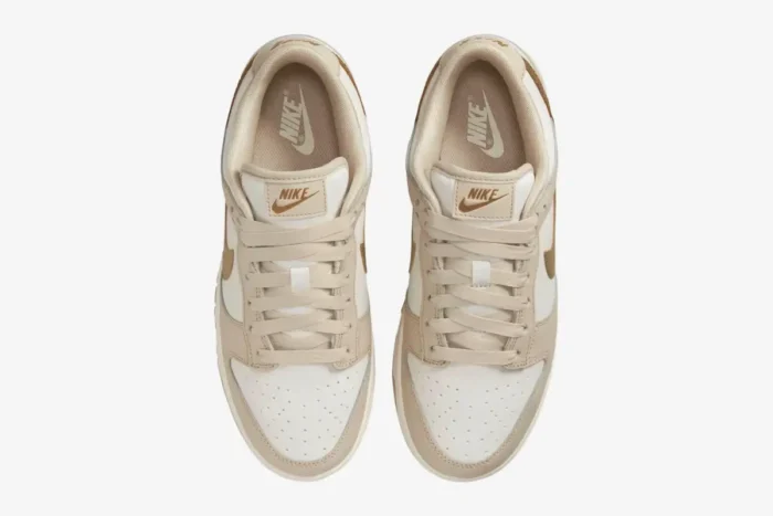 Top-down view of women's Nike Dunk Low Essential Trend in Phantom and Metallic Gold with beige laces. - SKU DX5930-001