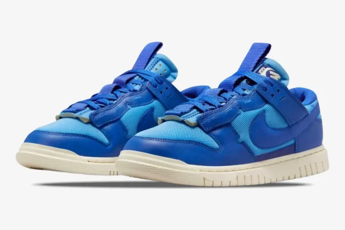 Nike Dunk Low Remastered Jumbo Blue sneakers shown in a three-quarter front view against a white background. - SKU DV0821-400