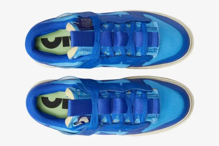 Top-down view of Nike Dunk Low Remastered Jumbo Blue sneakers with oversized tongues and mesh details. - SKU DV0821-400