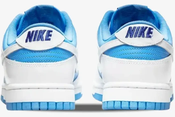 Rear view of Nike Dunk Low Reverse University Blue sneakers with white leather heels and blue embroidered logos. - SKU DJ9955-101