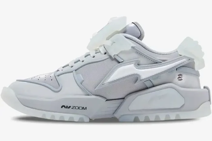 Side profile of Nike Dunk Low x RTFKT Void sneaker in light grey and white with translucent accents. - SKU HQ3034-001