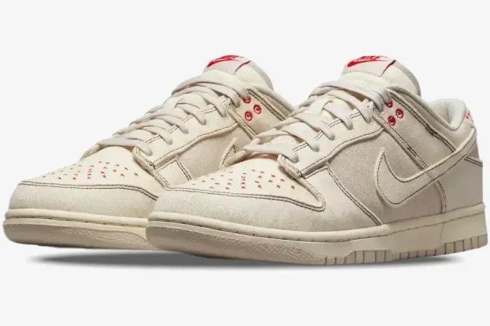 Nike Dunk Low SE Sashiko Light Orewood Brown sneakers, three-quarter front view with red stitching. - SKU DV0834-100