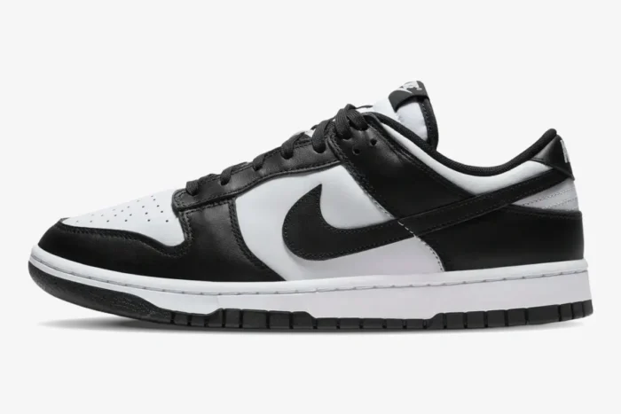 Side view of Nike Dunk SB Low Retro White Black Panda sneakers with black leather overlays and white base. - SKU DD1391-100