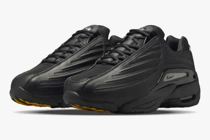 Black Nike Hot Step 2 x NOCTA sneakers shown from a three-quarter front perspective. - SKU DZ7293-001