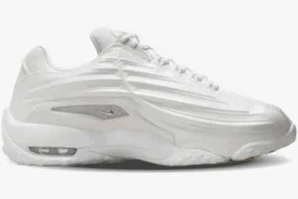 Side profile of the Nike Hot Step 2 x NOCTA sneaker in total white with molded ridges and visible Air unit. - SKU DZ7293-100