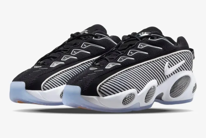 Nike NOCTA Glide sneakers in black and white with carbon fiber details, three-quarter front view. - SKU DM0879-001