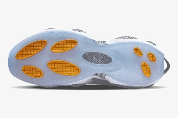 Bottom view of Nike NOCTA Glide sneaker featuring a translucent blue outsole with yellow traction pods. - SKU DM0879-001