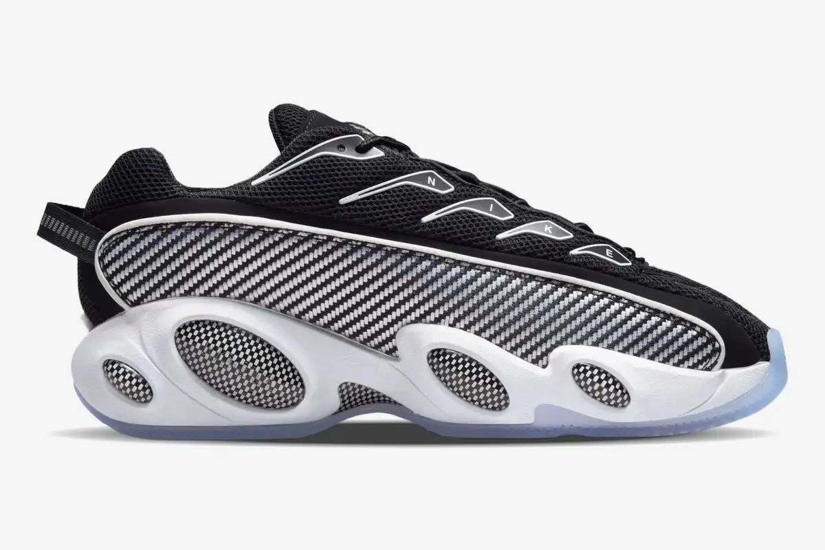 nike-nocta-glide-black-white-side-view-dm0879-001 Side view of Nike NOCTA Glide sneakers in black and white with carbon fiber patterns and a thick white midsole. - SKU DM0879-001