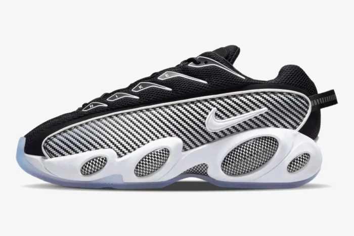Nike NOCTA Glide sneaker in black and white, side profile view with carbon fiber patterns and white midsole. - SKU DM0879-001