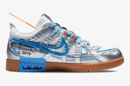 Side view of Nike Air Rubber Dunk x Off-White University Blue with silver overlays and a gum outsole. - SKU CU6015-100