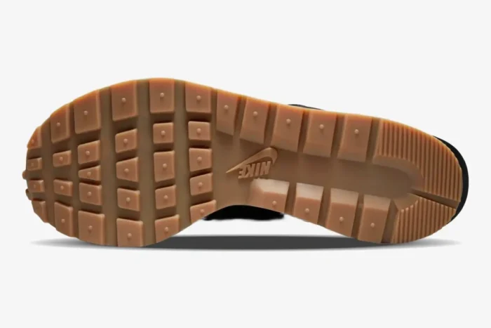 Bottom view of the gum rubber outsole on a Nike VaporWaffle x Sacai Black and Gum sneaker. - SKU DD1875-001