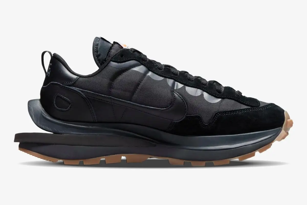 nike-sacai-vaporwaffle-black-gum-side-view-dd1875-001 Nike VaporWaffle x Sacai Black and Gum sneakers shown from a side profile view against a white background. - SKU DD1875-001