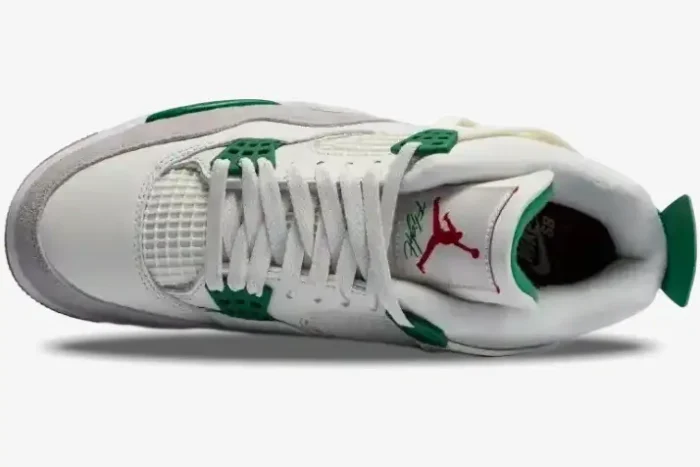 Top-down view of Air Jordan 4 Retro x Nike SB Pine Green sneakers with white leather, grey suede, and green accents. - SKU DR5415-103