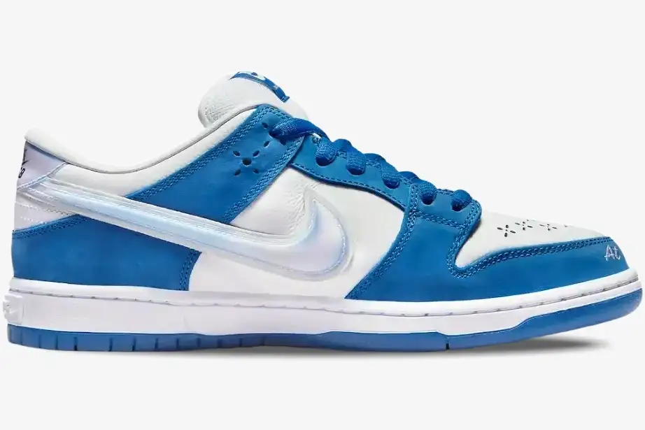 nike-sb-dunk-low-born-raised-blue-side-view-fn7819-400 Nike SB Dunk Low x Born x Raised sneaker in blue and white, side profile view with iridescent swoosh. - SKU FN7819-400