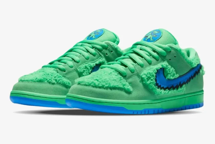 Nike SB Dunk Low x Grateful Dead Bears Green sneakers in a three-quarter front view with faux fur and blue accents. - SKU CJ5378-300