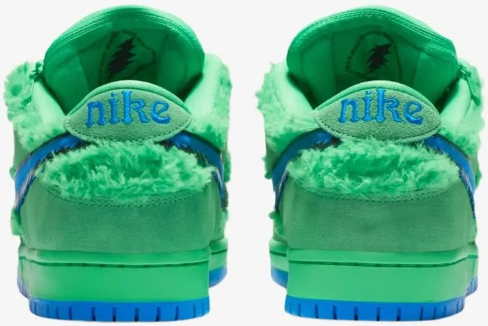 Rear view of green Nike SB Dunk Low Grateful Dead Bears sneakers with fuzzy texture and blue Nike logo. - SKU CJ5378-300