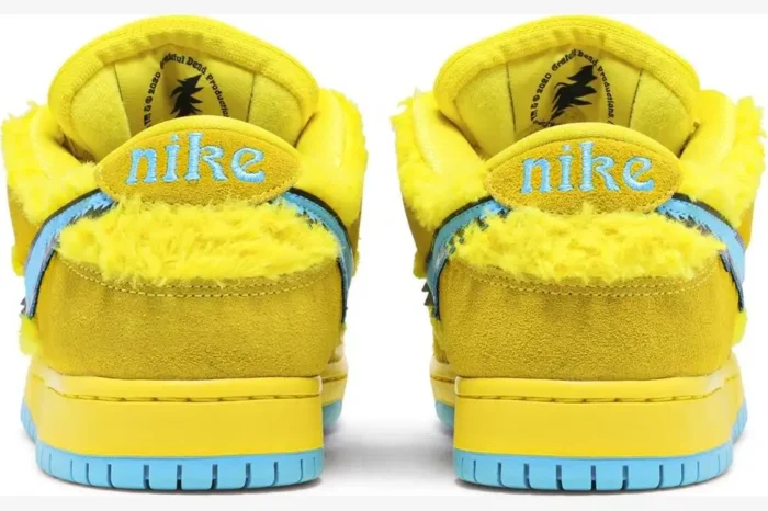 Rear view of Nike SB Dunk Low Grateful Dead Bears Opti Yellow sneakers featuring yellow faux fur and blue accents. - SKU CJ5378-700