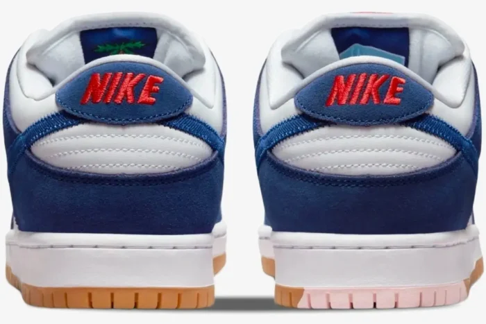 Rear view of Nike SB Dunk Low LA Dodgers sneakers in blue and white with pink gum detail. - SKU DO9394-100