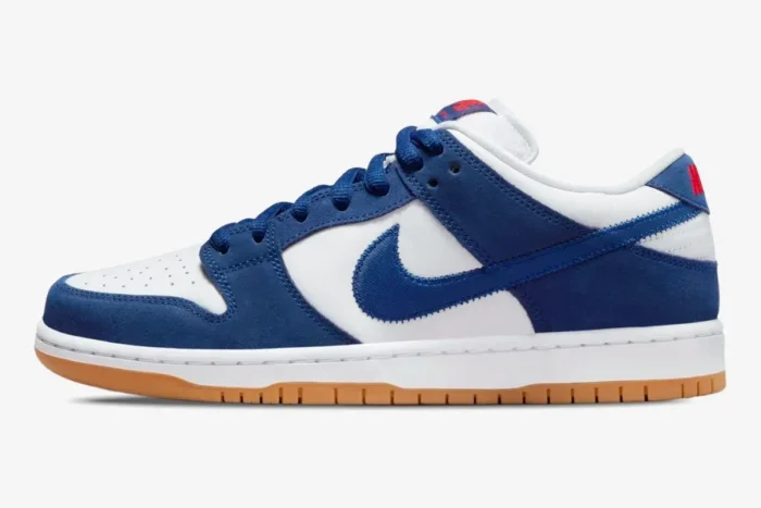 Side profile of Nike SB Dunk Low LA Dodgers in blue and white with a gum sole. - SKU DO9394-100