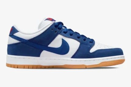 Nike SB Dunk Low LA Dodgers sneaker in blue and white with gum sole, side profile view. - SKU DO9394-100