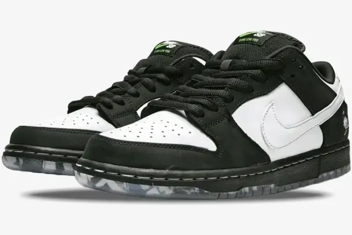 Black and white Nike SB Dunk Low x Staple Panda Pigeon sneakers, front three-quarter view. - SKU BV1310-013