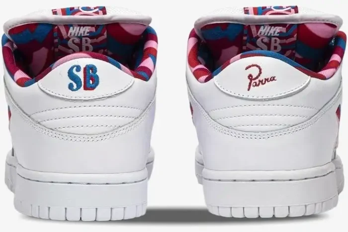 Rear view of Nike SB Dunk Low x Parra sneakers in white with colorful embroidered heel tabs and patterned lining. - SKU CN4504-100