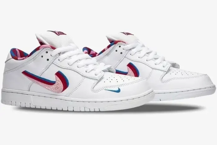 Nike SB Dunk Low x Parra sneakers in white with multi-colored layered swooshes, side profile view. - SKU CN4504-100