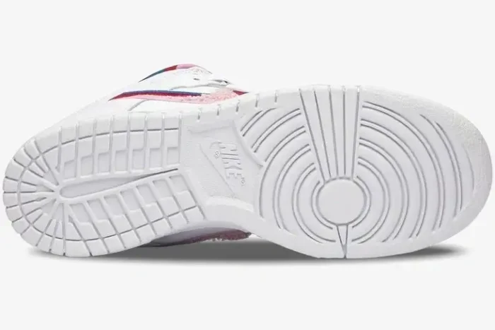 Bottom view of a Nike SB Dunk Low x Parra shoe showing the white rubber outsole with traction patterns. - SKU CN4504-100