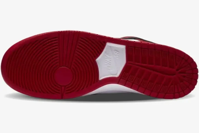 Bottom view of Nike SB Dunk Low Pro Chicago J-Pack showing red and white rubber outsole. - SKU BQ6817-600