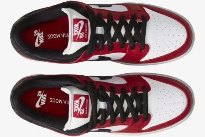 Top-down view of Nike SB Dunk Low Pro Chicago J-Pack sneakers in red, white, and black with black laces. - SKU BQ6817-600