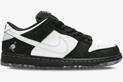 Side view of Nike SB Dunk Low Staple Panda Pigeon sneakers in black and white with a pigeon logo on the heel. - SKU BV1310-013