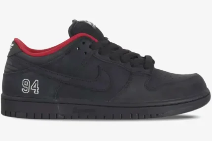 Side profile of Nike SB Dunk Low x Supreme in black with red lining and '94' heel embroidery. - SKU HQ8487001
